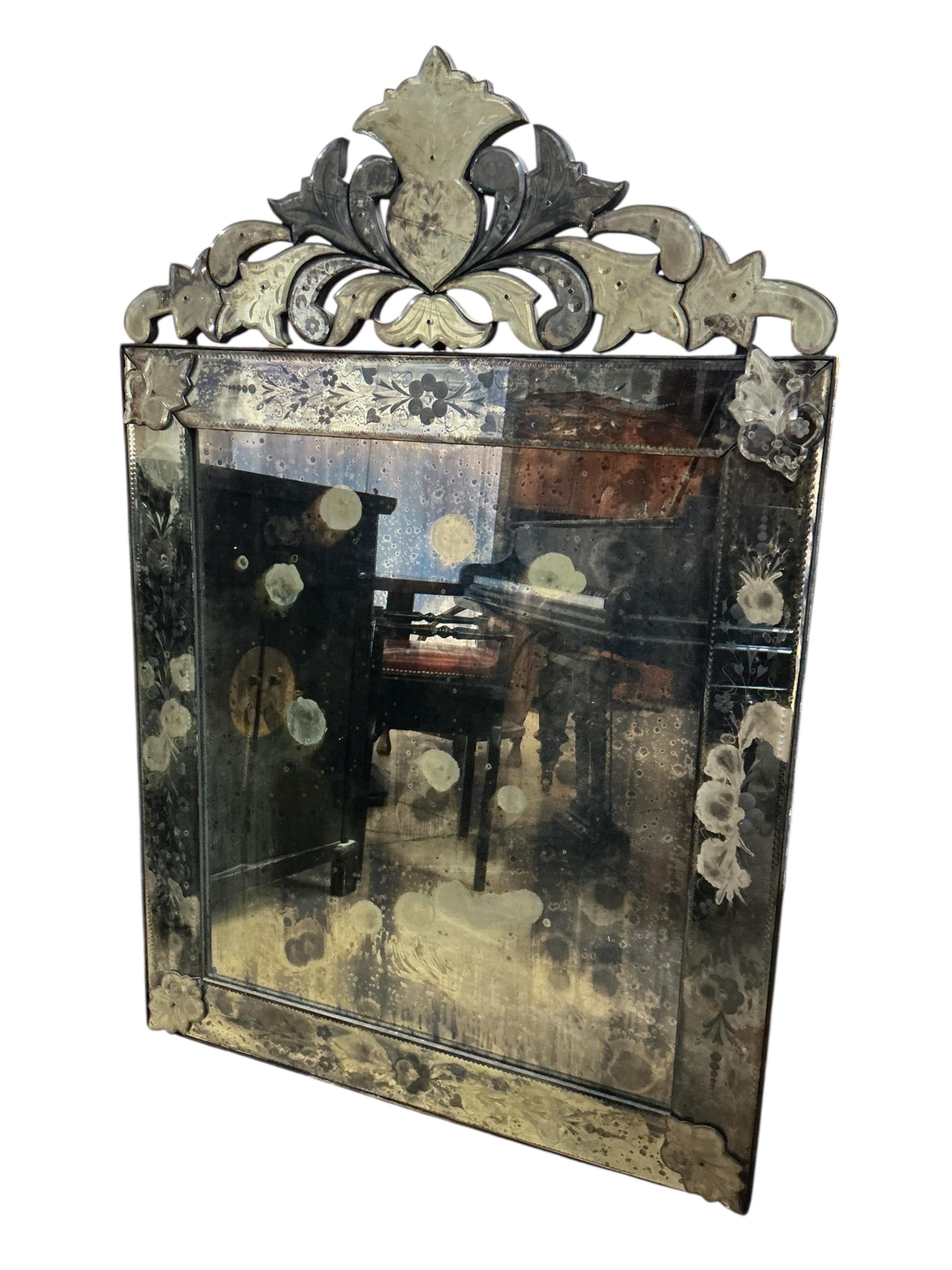 A Venetian wall mirror, width 92cm, height 136cm